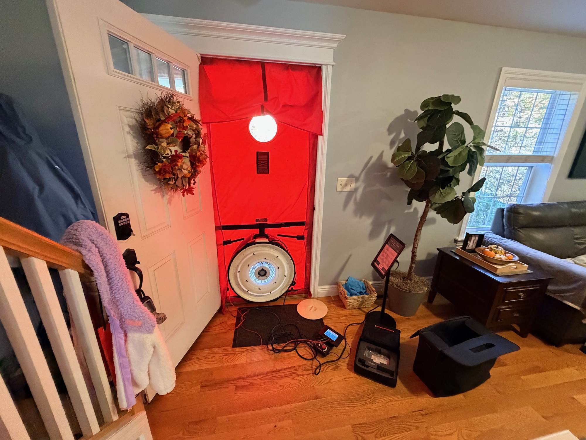 Blower door fan mounted in an exterior doorway for an airtightness test